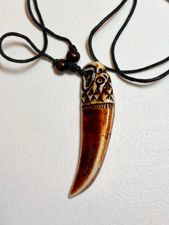 The Unbranded Brand Other - Carved Brown Tooth Pendant Necklace with Adjustable Black Cord.